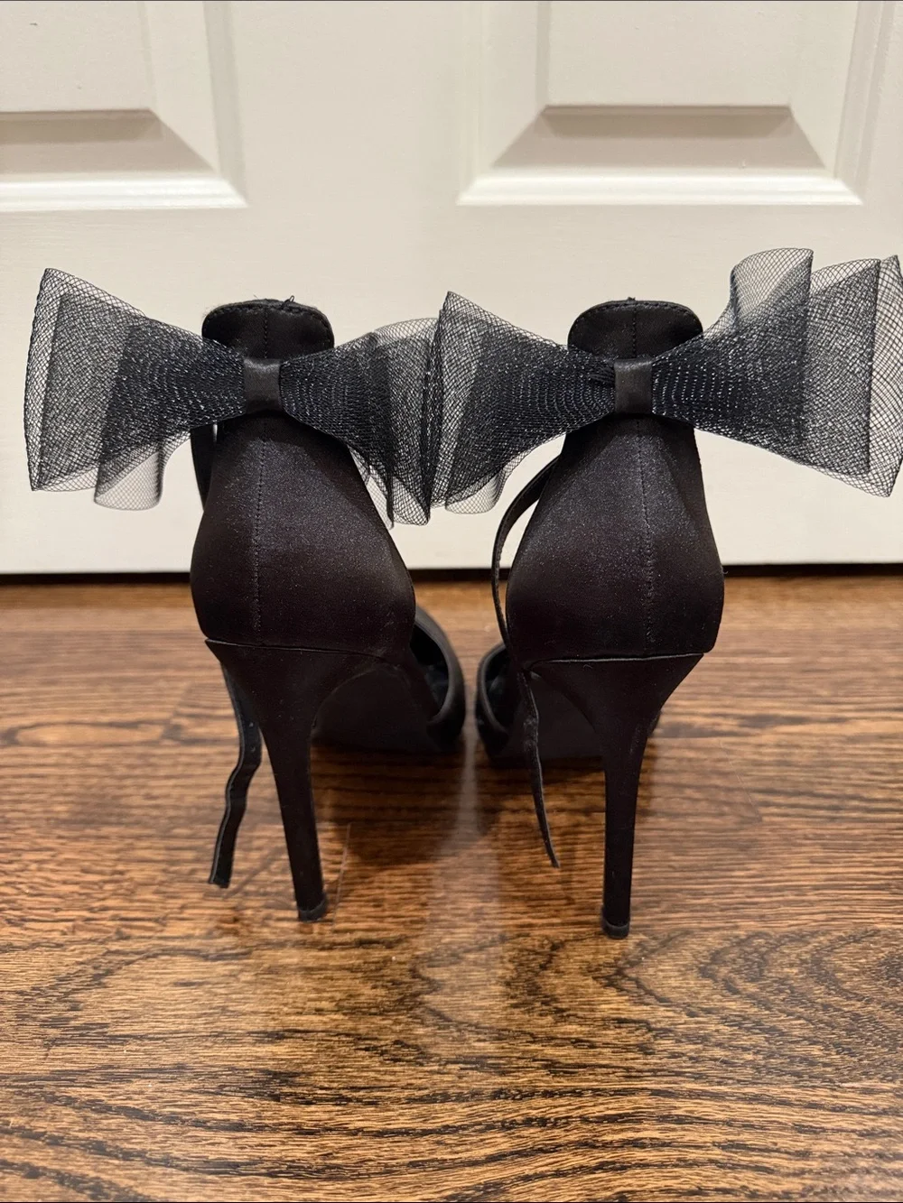 Elegant Black Pointed-Toe Ankle-Strap Heels with Bow Accent